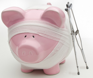 Photo of a piggy bank with crutches and gauze wrapping