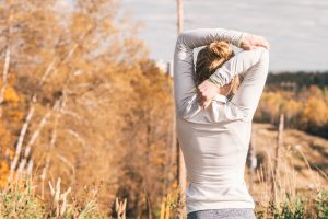 woman stretching outdoors