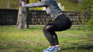 Woman doing a workout in her backyard